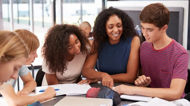 A black educator tutoring students