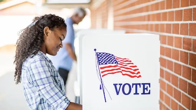 Girlholdingvotesign_2023