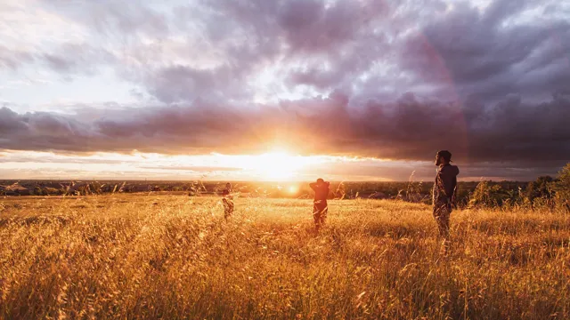 Guystandinginfrontofsunset_2023