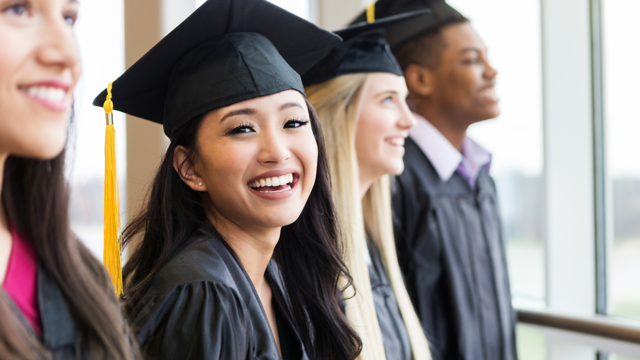 Students In Cap And Gown
