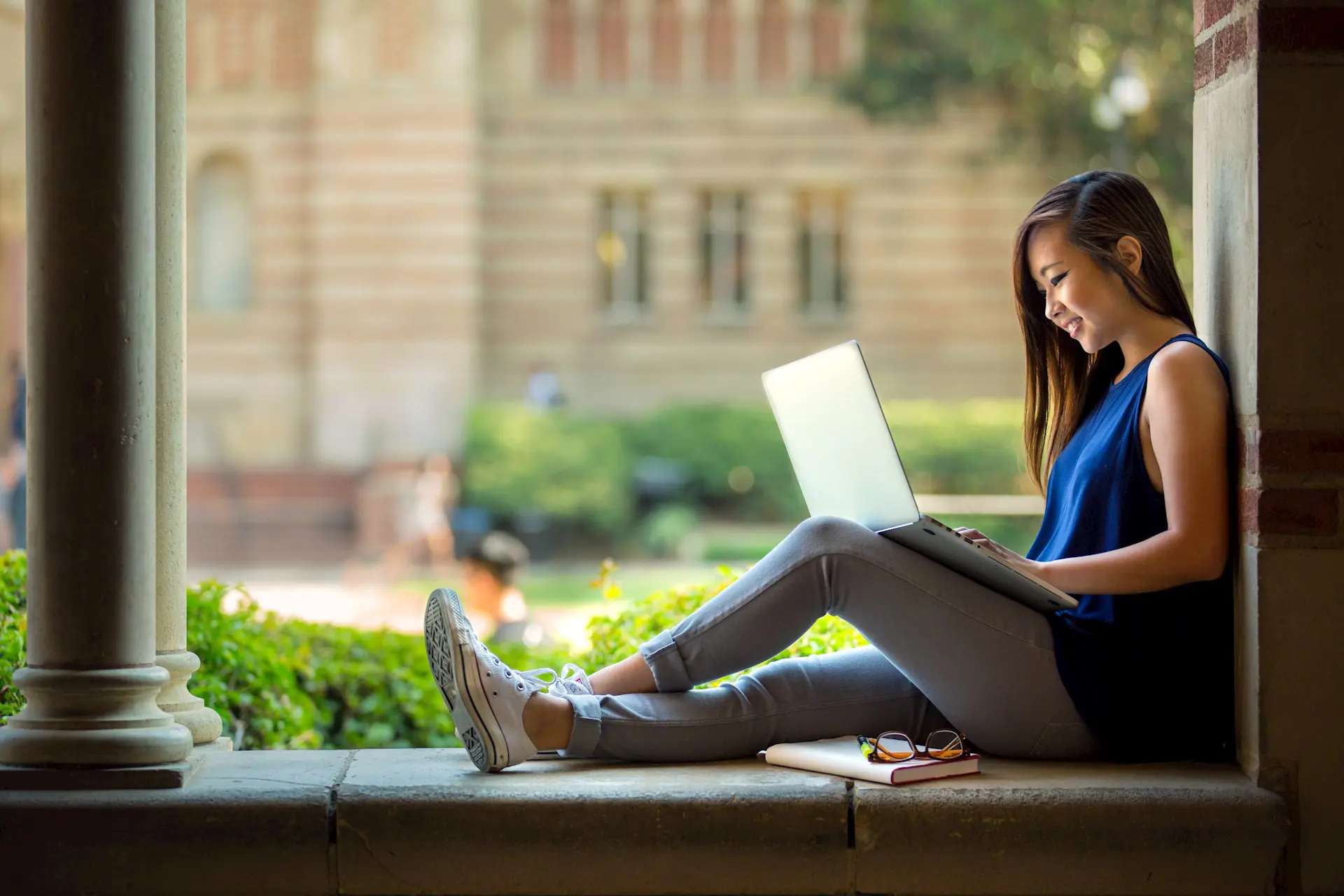 Student Smiling Studying Outdoors