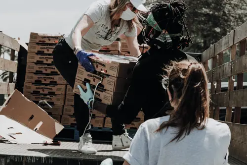 woman carrying boxes