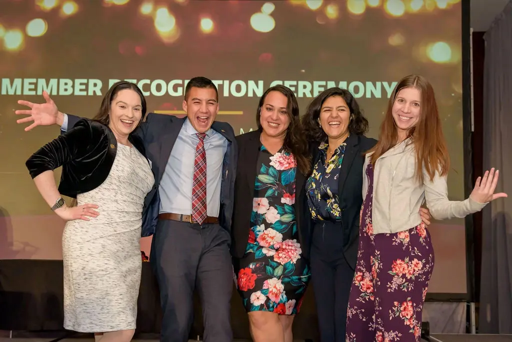 Group of people posing for a picture