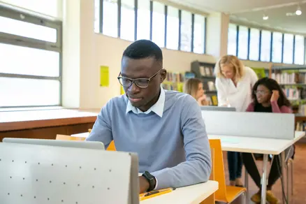 college student at a desk NSHSS