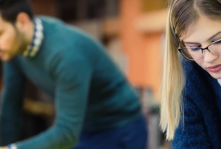 A Blonde student working on a project