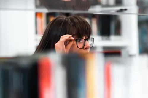 A girl working in a library