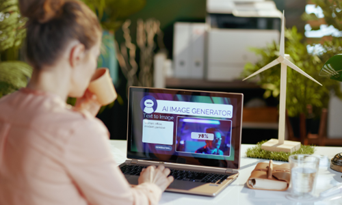 A girl using and AI image generator on her laptop