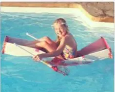 Young Ella learning about buoyancy with her handmade cardboard and duct tape boat
